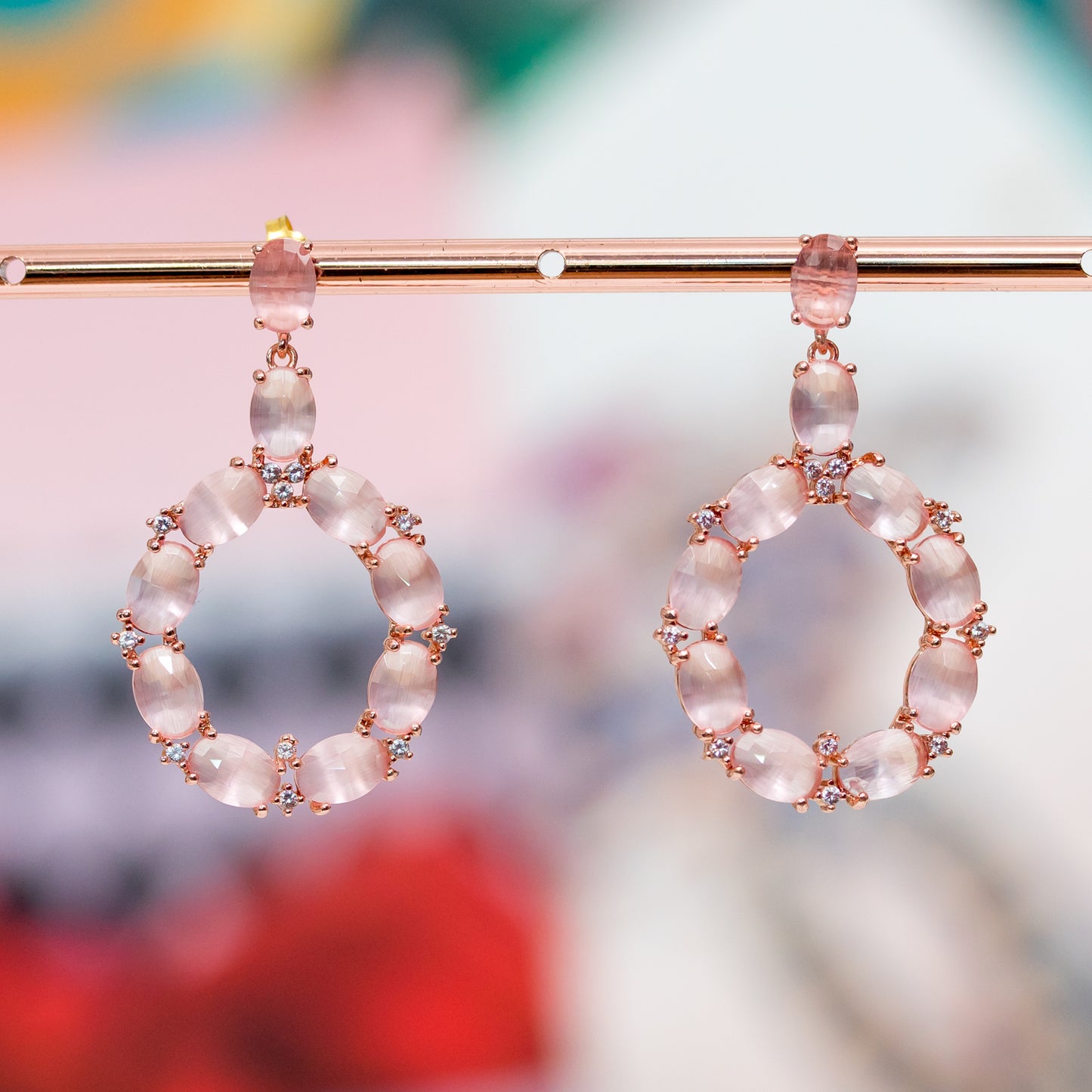Enveloping Elegance: Bronze Earrings with Cat's Eye and Zircons in Rose Gold